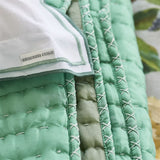 Detail of Chenevard Eau de Nil and Celadon Silk Quilt | Designers Guild