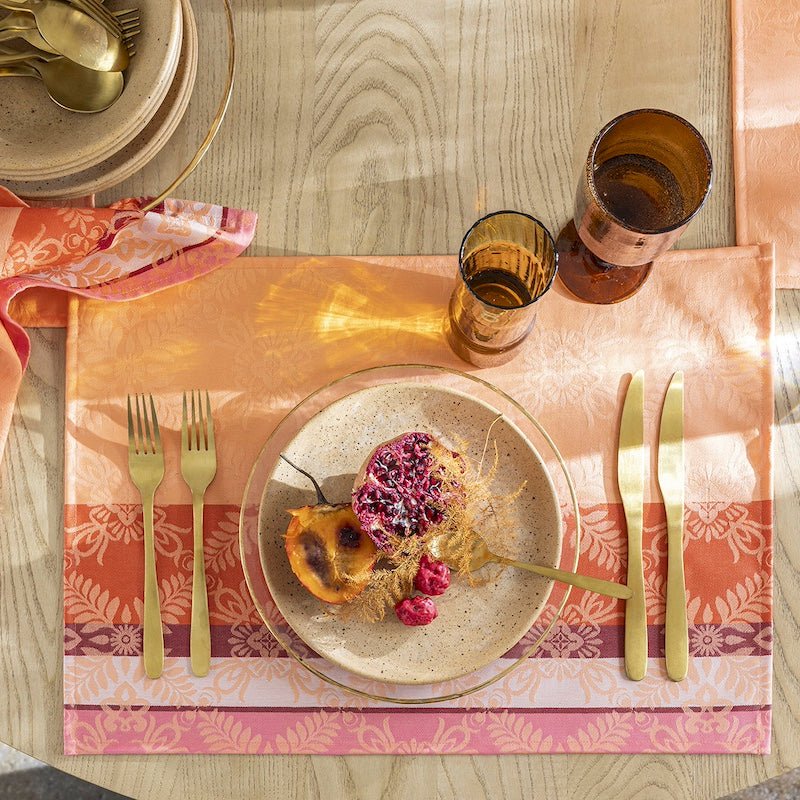 Le Jacquard Français Placemat enduit Mumbai Coated Marigold Orange at Fig Linens and Home