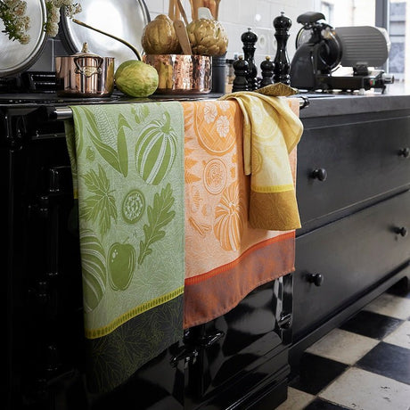 Thanksgiving Orange Tea Towel by Le Jacquard Français - In Kitchen with other Tea Towels